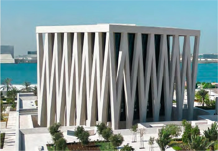 Manarat Living building with landscaped entrance and shaded walkways